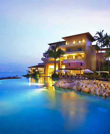 Panoramic view of Garza Blanca Puerto Vallarta with lush greenery and oceanfront setting